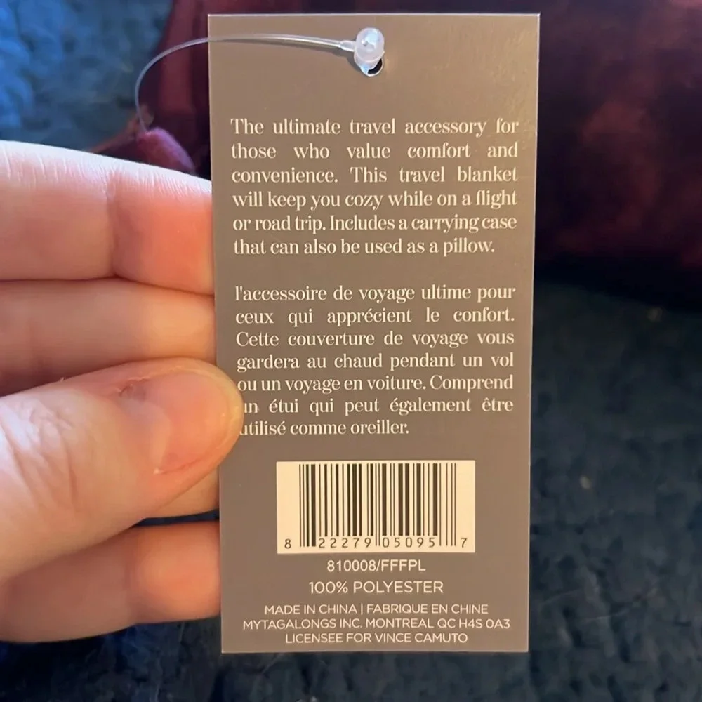 Vince camuto travel blanket with zipper storage bag.